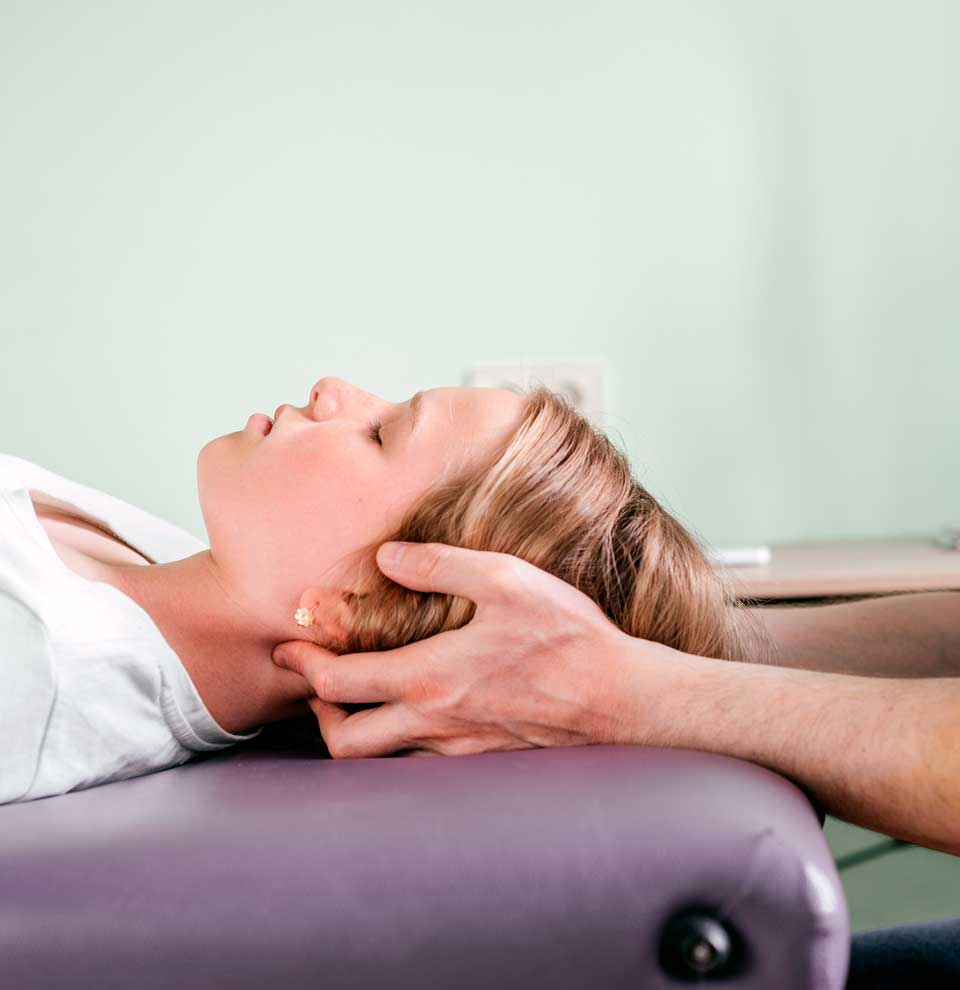 Chiropractor in Crystal Lake, IL a chiropractor is treating a lady patient